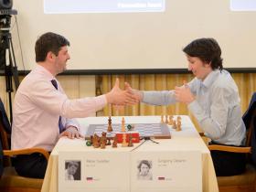 Svidler and Oparin playing some strange hand clapping game to determine the winner after a drawn game
