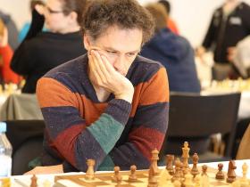 French Grandmaster Christian Bauer pondering over his next move